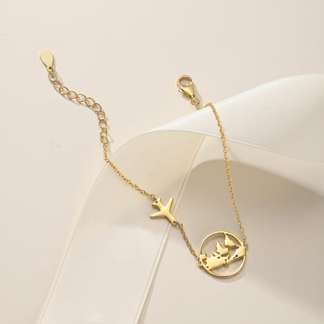 Armband mit Weltkugel und Flugzeug – Sterling Silber vergoldet