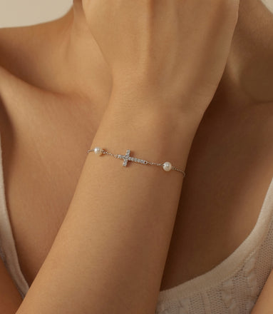 925 Sterling silver bracelet with cross pendant, set with zirconia stones and 2x genuine pearls