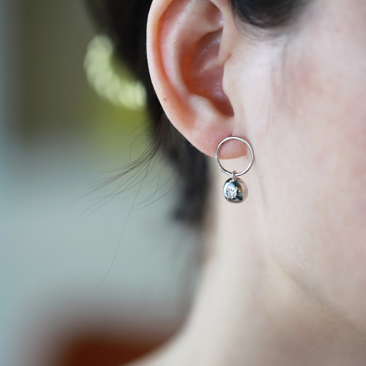 Sterling silver earrings with star embossing and zirconia stone