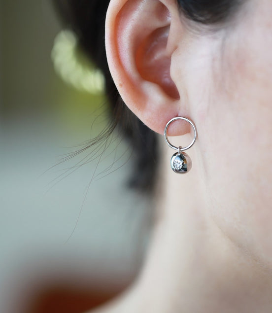 Sterling silver earrings with star embossing and zirconia stone