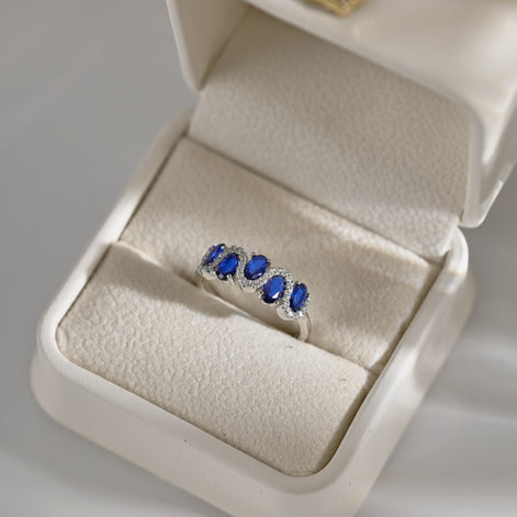 925 silver ring with oval blue zirconia stones and sparkling accents