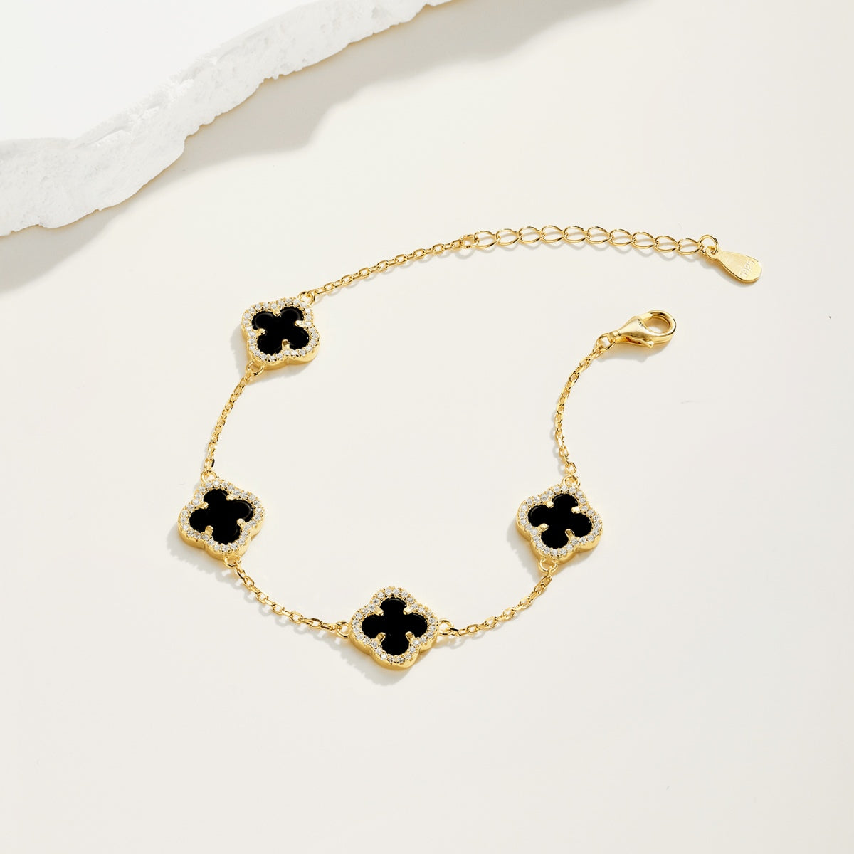 Gold-plated bracelet made of 925 silver – with black clover leaf pendants & zirconia