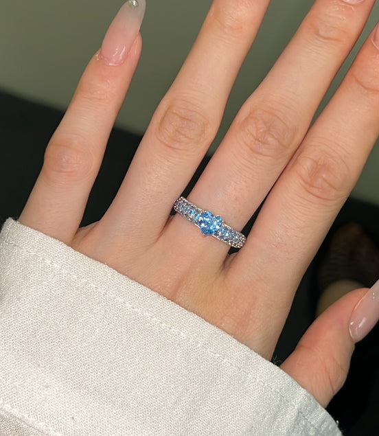 925 silver ring with heart zirconia in light blue and sparkling zirconia edge