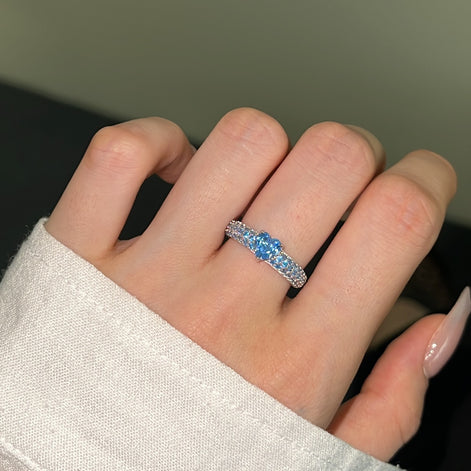 925 silver ring with heart zirconia in light blue and sparkling zirconia edge