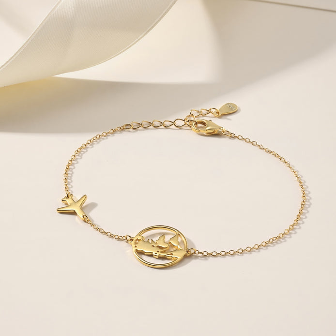 Bracelet with globe and airplane – sterling silver gold-plated