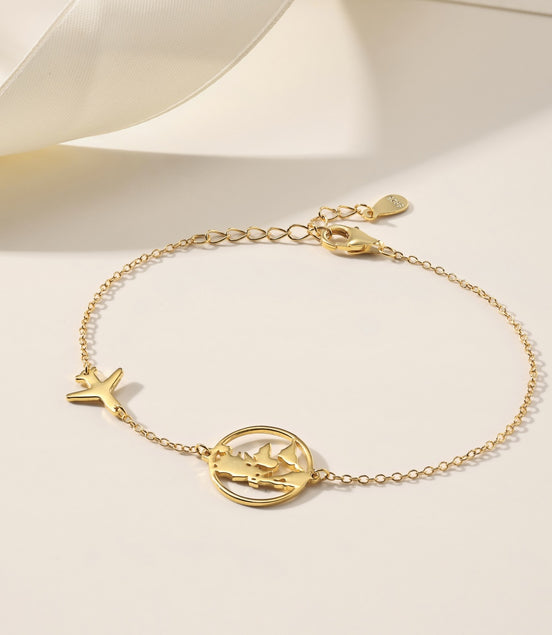 Bracelet with globe and airplane – sterling silver gold-plated