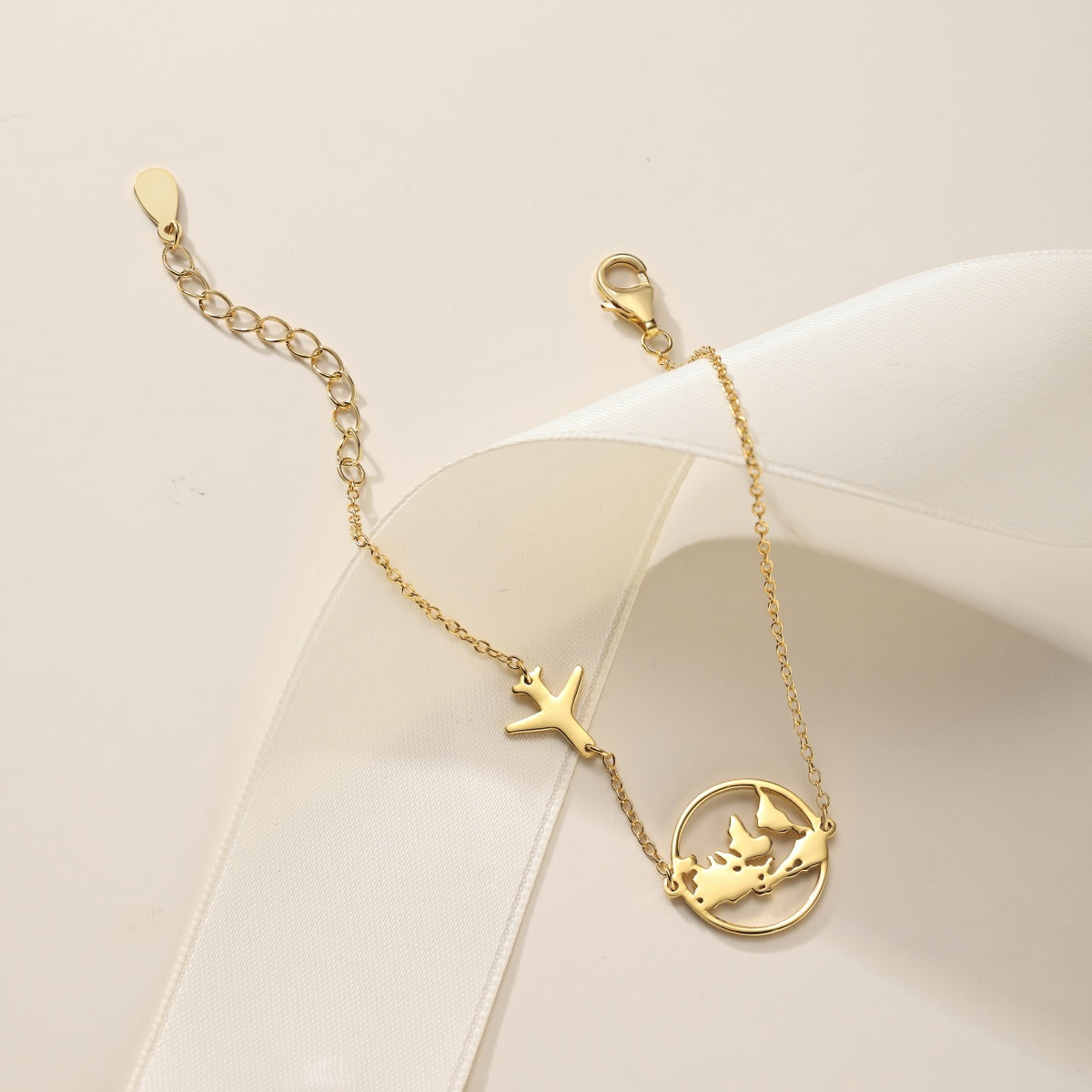 Bracelet with globe and airplane – sterling silver gold-plated