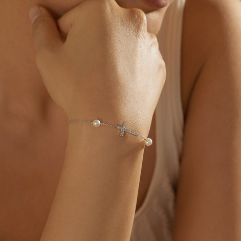 925 Sterling silver bracelet with cross pendant, set with zirconia stones and 2x genuine pearls