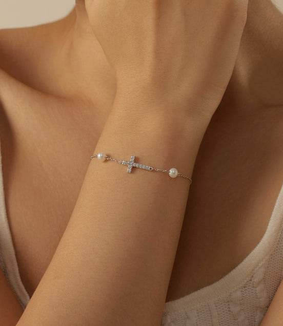 925 Sterling silver bracelet with cross pendant, set with zirconia stones and 2x genuine pearls