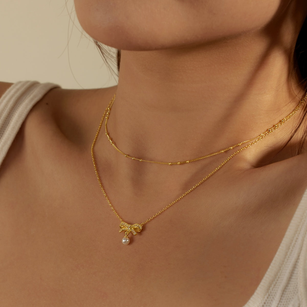 18K gold-plated double chain made of 925 sterling silver with bow pendant & pearl