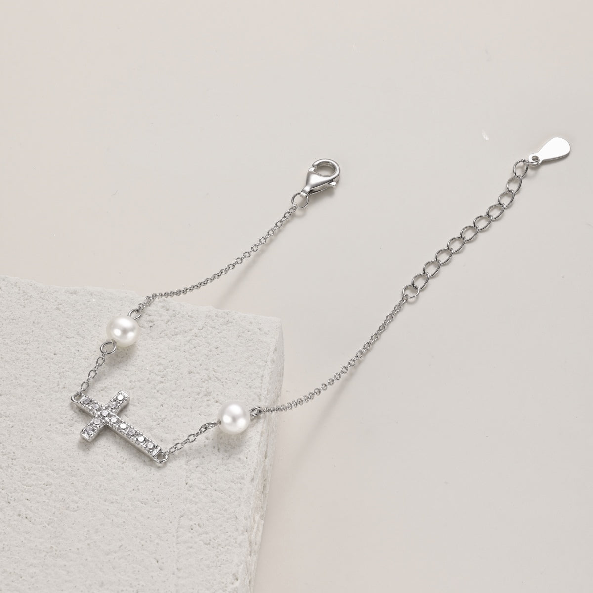 925 Sterling silver bracelet with cross pendant, set with zirconia stones and 2x genuine pearls