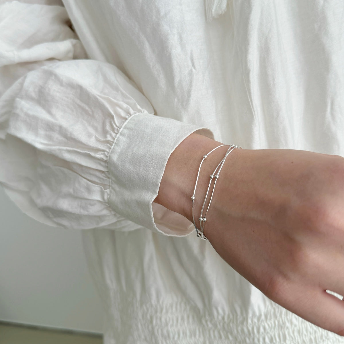 Multi-row bracelet made of 925 silver with ball details