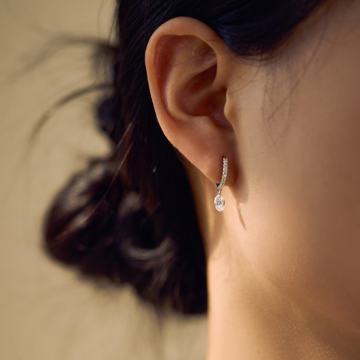Hoop earrings made of 925 sterling silver with zirconia stones and oval pendant