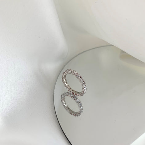 Sterling silver ring set with fine zirconia stones all around