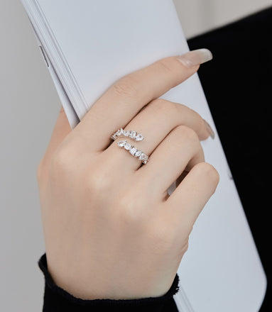 Adjustable 925 silver ring with 12 zirconia stones in unique shapes